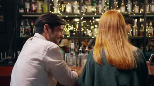 4K Group of People enjoy hangout nightlife at luxury bar.