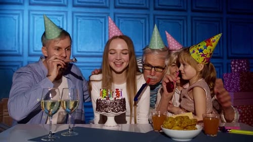 Friends and Family Celebrate Birthday with Cake