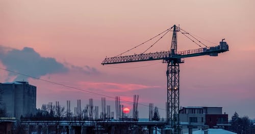 Footage Time Lapse of Sunset in a Industrialized Are of the City