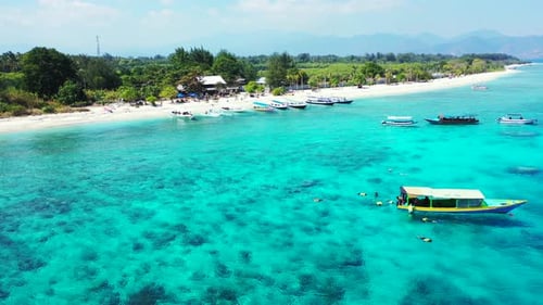 Wide angle aerial abstract view of a white sandy paradise beach and aqua blue water background in 4K