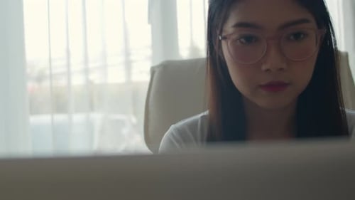Asian women working on laptop at office. Young Asia business Girl using the computer.