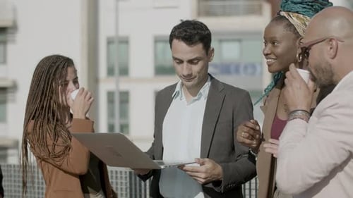 Side View of Happy Group of Colleagues Working Together Outdoor