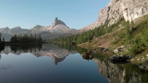 Aerial Flying over Mountain Lake Federa in Dolomites Alps Italy