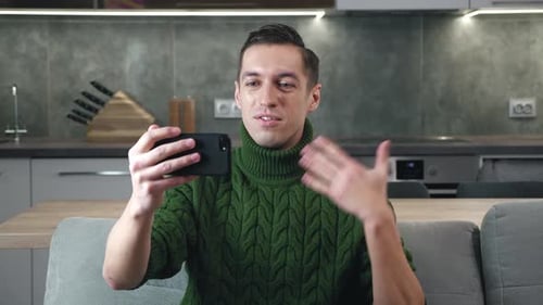 Man Waving Hand During Smartphone Video Call