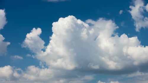 Beautiful White Clouds Floating At The Blue Sky On A Sunny Day