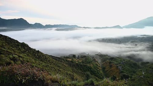 A Group of Clouds in the Sky Over a Volcano