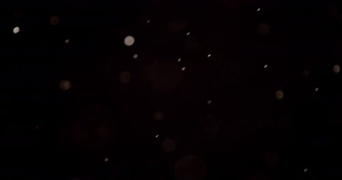 Sparkling Particles on Black Abstract Background