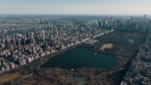 Aerial Drone Flight Above Green Central Park in Manhattan