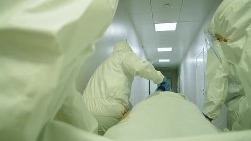Medical Team Racing Patient Through Hospital Corridor