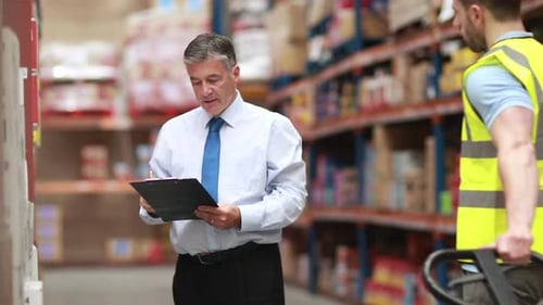 Warehouse Worker with his Manager