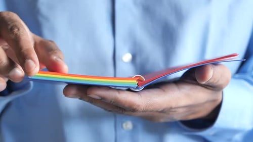 Close Up Man's Hand Turning Pager Diary