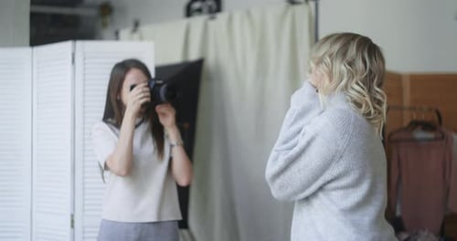 Beautiful Woman Poses To the Photographer at the Christmas Photoshoot, at the Photo Studio with