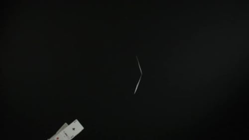 Playing Cards Falling in Slow Motion on Black