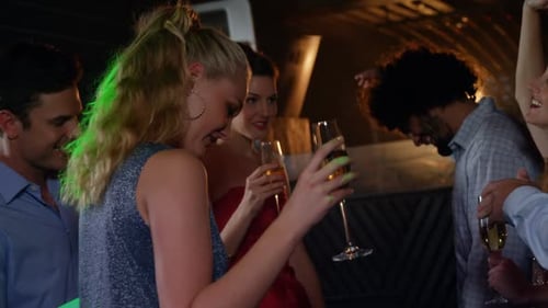 Group of friends dancing in pub