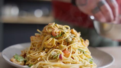 Gourmet Pasta Dish Garnished in Home Kitchen