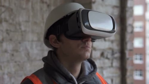 Construction Worker Using Virtual Reality Headset on Site