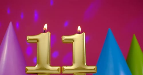 Burning Number Eleven Candles with Party Hats