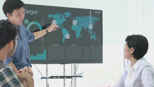 Colleagues Collaborating During a Workplace Presentation