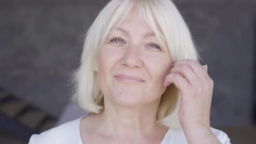 Smiling Woman with Short Blonde Hair Close Up Portrait