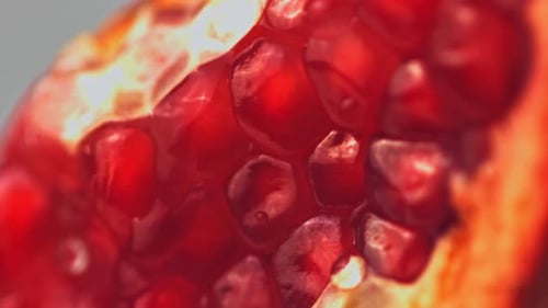 Super Slow Motion with a Piece of Pomegranate Drains Water