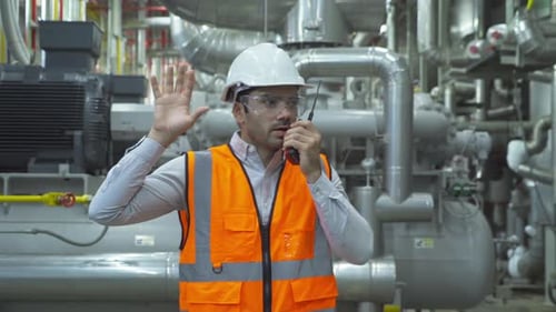 An engineer man or worker, people working in industry factory. Chiller tower or cooling tower