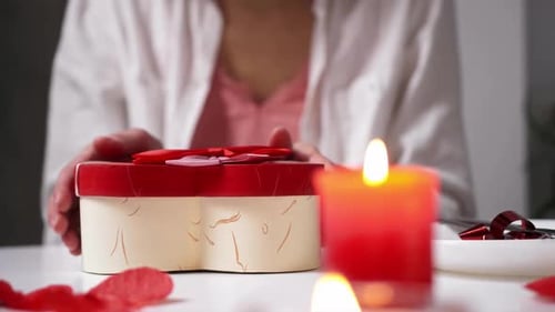 Woman Opens Heart Shaped Gift Box With Candles