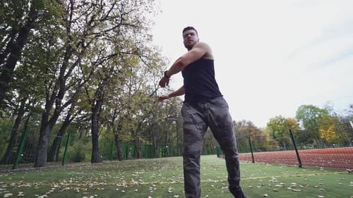 Muscular Man Stretching Outdoors for Fitness