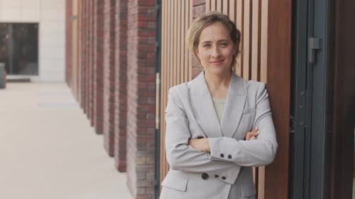 Confident Woman Smiling in a Corporate Setting