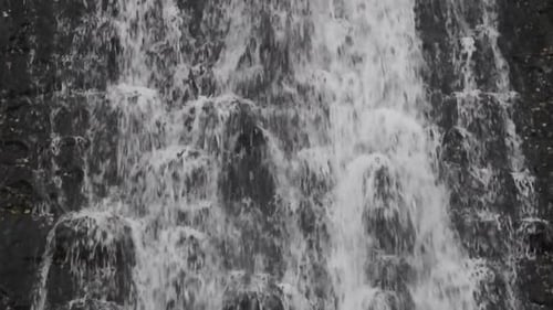 Scenic Waterfall Cascading Over Rocks