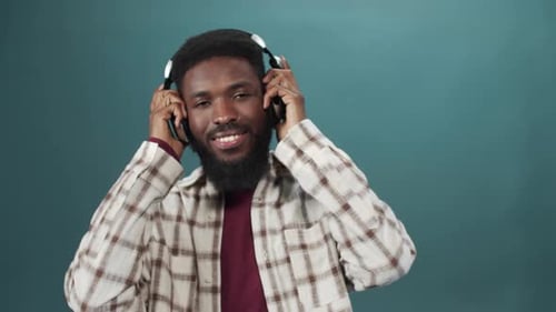 Young Adult Enjoying Music with Headphones