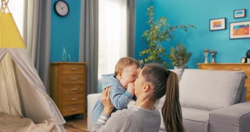 Mother and Infant Playing Together in Living Room