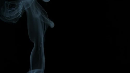 Wispy Smoke Billowing on Black Background