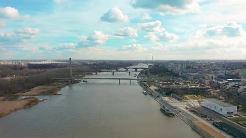 Aerial Drone Flight Footage of a Bridge with Car Traffic Surrounded By Beautiful City Landscape