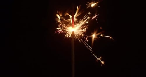 Festive Sparkler Ignites Night With Dazzling Golden Sparks