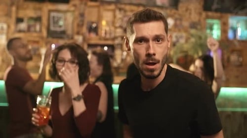 Young Adults Dancing and Partying at Night in Bar