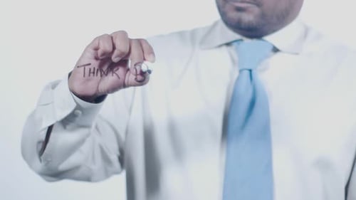 Asian Businessman Writes Think Big