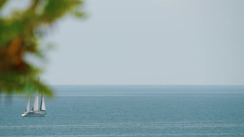 Sailing Yacht in Quiet Blue Sea