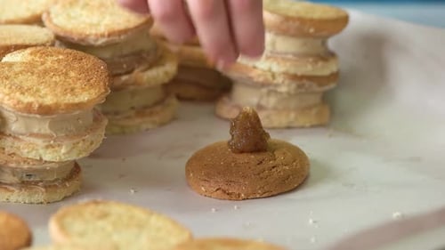 Chef Hand Putting Jam on Cookie