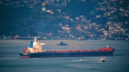 Establishing Shot of Cargo Ship on Waterway