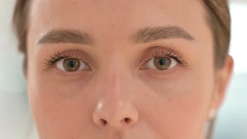 Close Up of Blinking Eyes of Young Woman