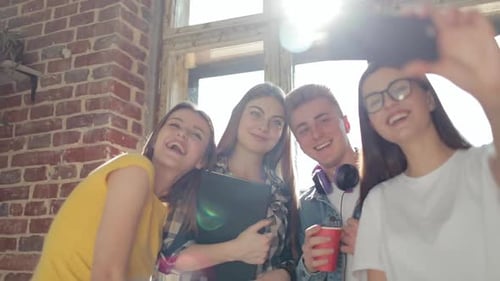 Friends Laughing Together for Group Selfie Indoors