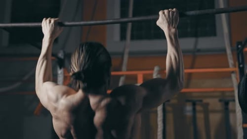 Athletic Man Doing Pull Ups
