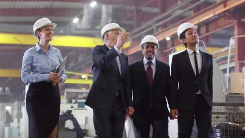 Team of Engineers Visiting Factory