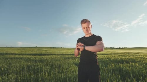 A Young Man is Standing on the Field