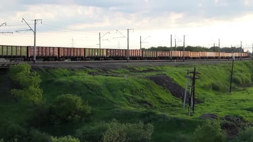 Freight Train Rolling Through Countryside