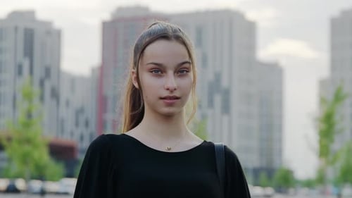 Young Woman Smiling Portrait in an Urban Setting