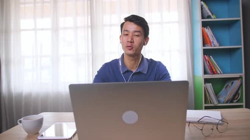 Man Attending Meeting At His Computer