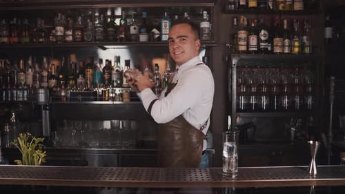 Bartender Creates Cocktail at Urban Bar Setting