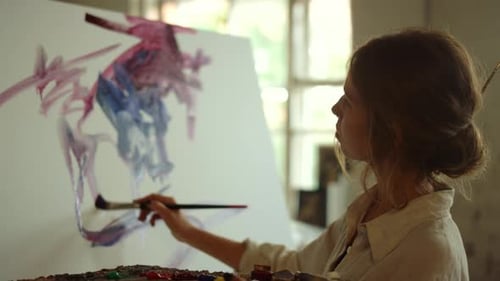 Young Woman Artist Drawing in Studio