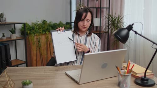 Young Woman Freelancer Wearing Headset Call Center or Support Service Operator Helpline Having Talk